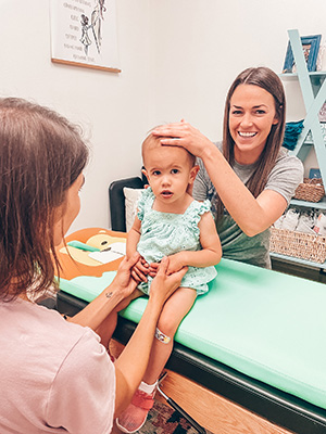 Chiropractor Orlando FL Dr. Kasey Johnson with Child Chiropractor Orlando FL Dr. Kasey Johnson with Child