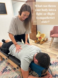 Chiropractor Orlando FL Kasey Johnson Adjusting Patient